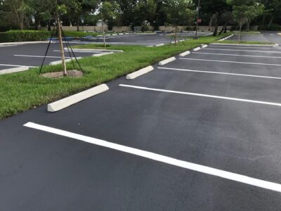 A Parking Lot With a Grass Divider